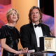 Producers Bill Pohlad and Dede Gardner accept the Palme D’Or on Malick’s behalf. (Photo: Getty)